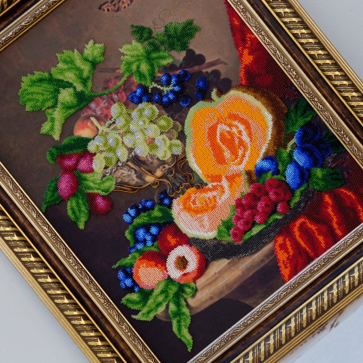 Close-up of vibrant beads creating a still life with a pumpkin design.